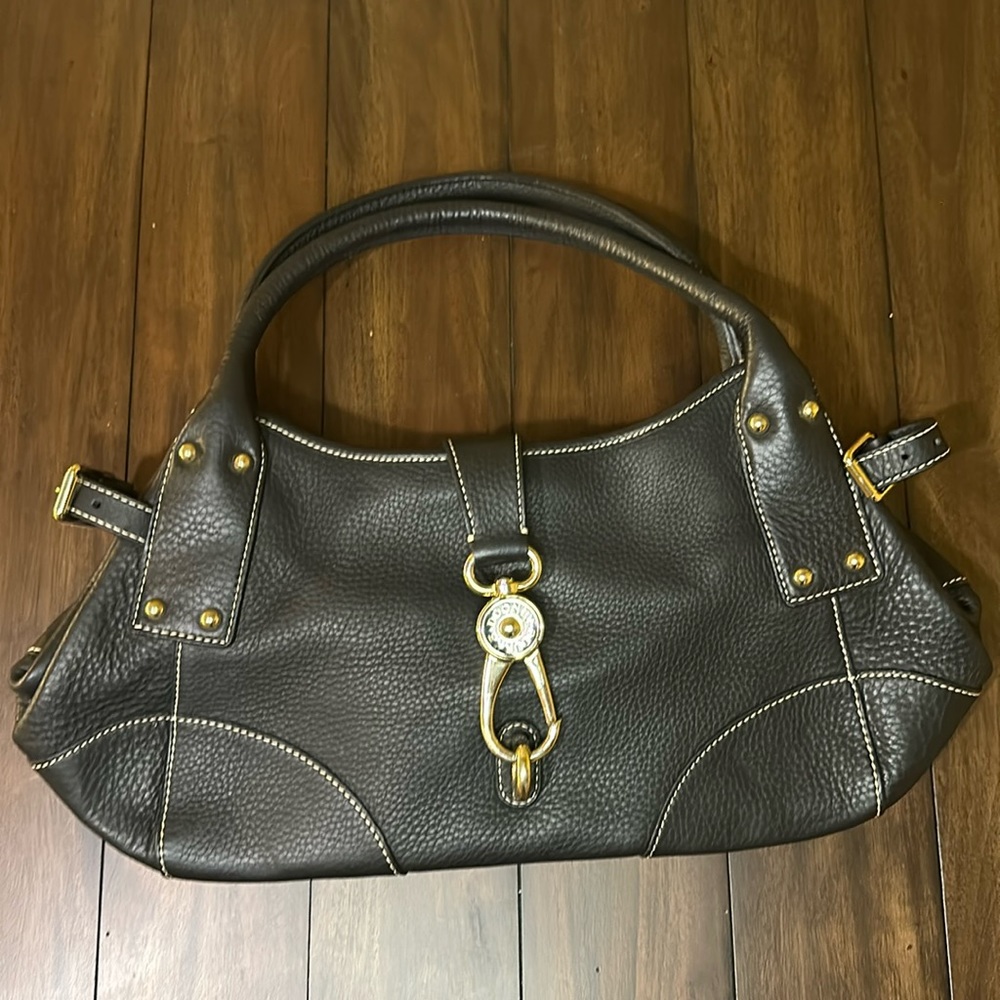Dooney Bourke black leather purse/handbag with gold clip, pink inside.